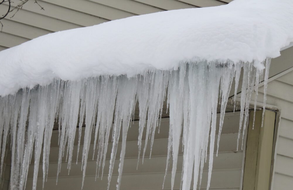 Ice Dams Forming On A Home Gutter System